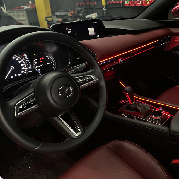 Monochrome or RGB LED ambient lighting with interior doors, dashboard, seats