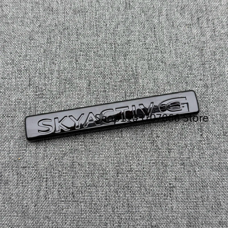 Badge SKYACTIV 3D Chromé ou Noir pour Hayon – Mazda