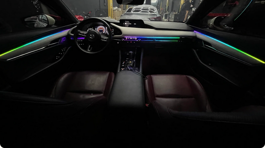 Monochrome or RGB LED ambient lighting with interior doors, dashboard, seats