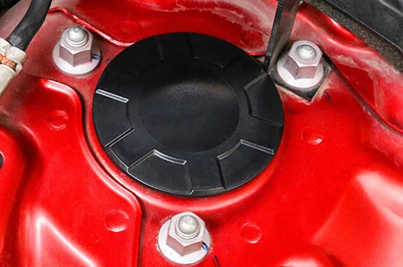 Decorative dust cover for shock absorber screw